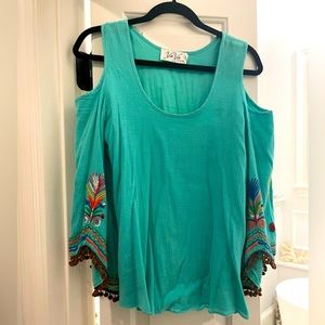 Unique, Cold shoulder top with embroidery details.